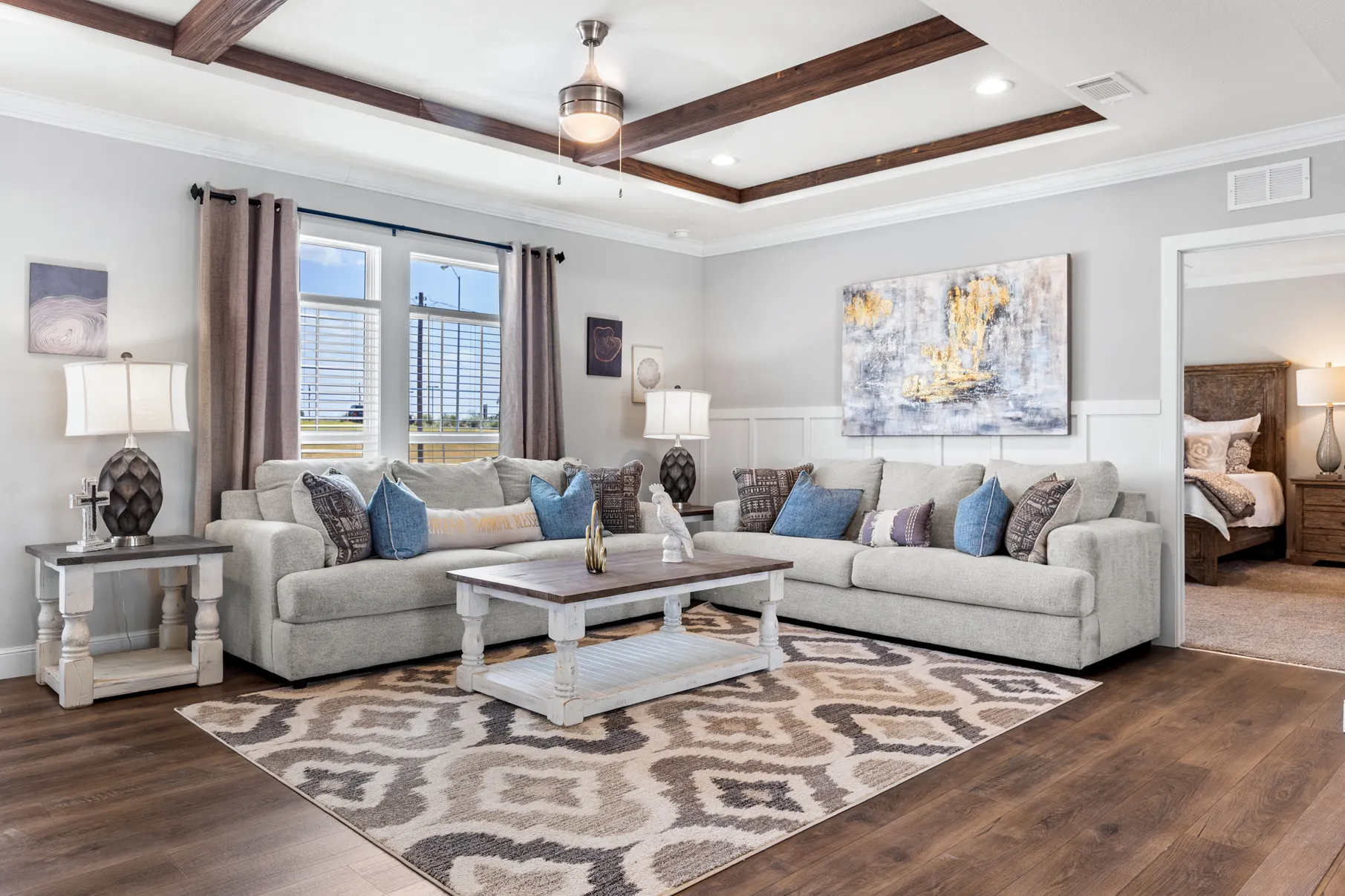 Bright El Capitan model living room and kitchen